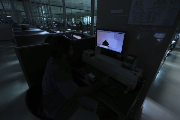 A computer screen shows an representative image of a diamond in the designing area of Shree Ramkrishna Exports in Surat, India, on April 14, 2025. (AP Photo/Ajit Solanki)