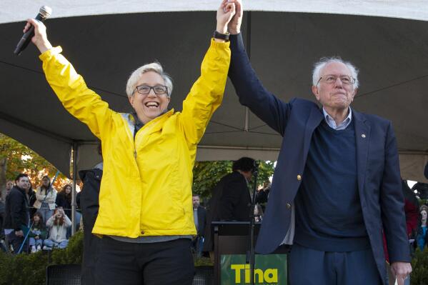 Oregon Democratic gubernatorial candidate Tina Kotek, left, and Vermont Sen. Bernie Sanders acknowledge the crowd during a visit to the University of Oregon campus in Eugene, Ore., Thursday, Oct. 27, 2022.  Sanders kicked off an eight-state tour Thursday, hoping to energize young voters and shore up support for vulnerable Democratic candidates ahead of the midterm elections. (Chris Pietsch/The Register-Guard via AP)