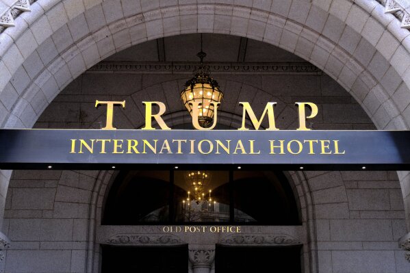 FILE - In this March 11, 2019 file photo, the Trump International Hotel is seen in Washington. District of Columbia Attorney General is suing President Donald Trump's inaugural committee and two companies that control the Trump International Hotel in D.C., accusing the groups of abusing nonprofit funds to benefit Trump's family.  (AP Photo/Mark Tenally)