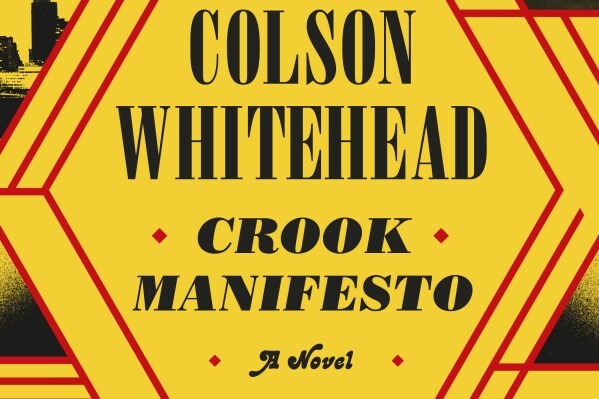 This cover image released by Doubleday shows "Crook Manifesto" by Colson Whitehead. (Doubleday via AP)