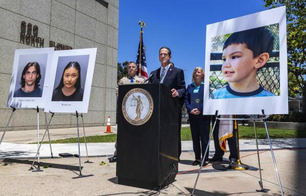 FILE - In this June 8, 2021 file photo Orange County District Attorney Todd Spitzer announces, in Santa Ana, Calif., charges filed against suspects Marcus Eriz and Wynne Lee in the death of Aiden Leos, right, the 6-year-old boy who was shot and killed on his way to kindergarten in his mother's car. Prosecutors say they want a Eriz, held without bail after charging him with the murder of Aiden Leos in a road rage incident. Orange County prosecutors wrote in court papers this week that Eriz told police he grabbed a gun, rolled down the window and shot at a car driven by a woman who made a rude gesture toward him on the freeway on May 21. (Mark Rightmire/The Orange County Register via AP)