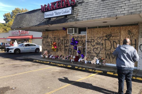 A memorial to slain rapper Young Dolph sits in front of the boarded windows at Makeda's Cookies on Thursday, Nov. 18, 2021, in Memphis, Tenn. Police said Young Dolph was fatally shot inside the popular Memphis bakery on Wednesday. (AP Photo/Adrian Sainz)
