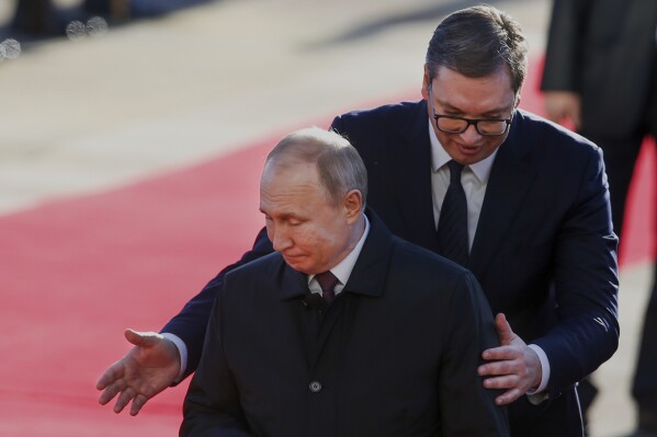 Serbian President Aleksandar Vucic, right, welcomes Russian President Vladimir Putin for the talks in Belgrade, Serbia, Thursday, Jan. 17, 2019. (AP Photo/Darko Vojinovic, File)