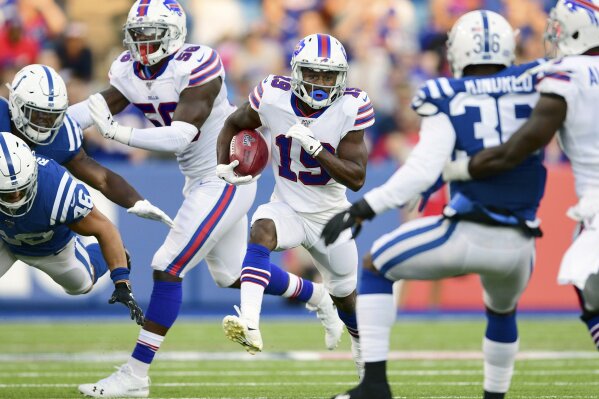 FILE - In this Aug. 8, 2019, file photo, Buffalo Bills' Isaiah McKenzie, center, runs the ball during the first half of an NFL preseason football game against the Indianapolis Colts, in Orchard Park, N.Y. With NFL cutdown day approaching, Bills receiver Isaiah McKenzie is confronted with the reality of his uncertain future each time he takes a seat at his locker.(AP Photo/David Dermer, File)
