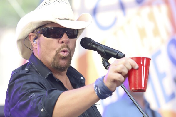 File - Country music recording artist Toby Keith holds a red Solo cup as he performs on NBC's Today show at Rockefeller Plaza on July 5, 2019, in New York. Keith, who died Monday at 62, immortalized the humble plastic cups in his 2011 hit "Red Solo Cup."(Photo by Greg Allen/Invision/AP, File)