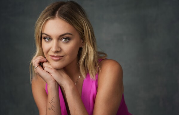 FILE - Singer/songwriter Kelsea Ballerini poses for a portrait in Los Angeles on Aug. 1, 2023. Ballerini’s “Rolling Up the Welcome Mat” is up for best country album. (AP Photo/Chris Pizzello, File)
