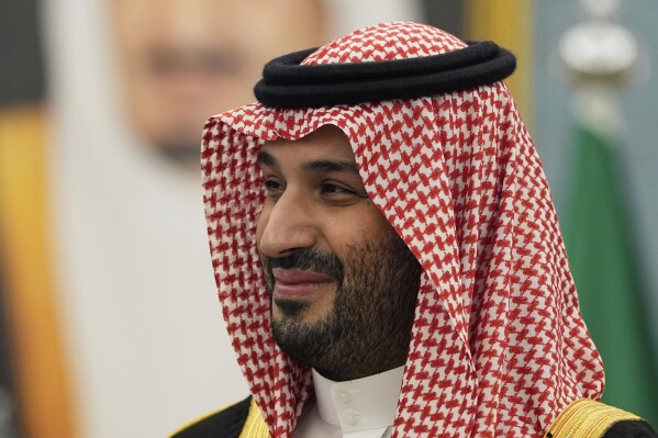 Saudi Crown Prince Mohammed bin Salman joins President Donald Trump to greet delegations at the Royal Palace in Riyadh, Saudi Arabia, Tuesday, May 13, 2025. (AP Photo/Alex Brandon)