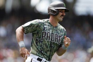 FILE - San Diego Padres' Matt Carpenter runs the bases on a two-run home run during the team's baseball game against the Boston Red Sox on May 21, 2023, in San Diego. Carpenter was acquired by the Atlanta Braves along with left-hander Ray Kerr and cash from the San Diego Padres on Friday, Dec. 15, for outfielder Drew Campbell. (AP Photo/Brandon Sloter, File)