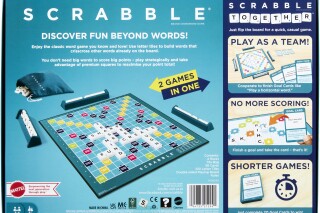 This photo provided by Mattel shows the new version of the board game Scrabble, that includes a new version called Scrabble Together. Mattel has unveiled a double-sided board that features both the classic word-building game and Scrabble Together, a new rendition aimed at making Scrabble more accessible “for anyone who finds word games intimidating." (Mattel via AP)