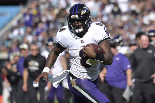 FILE - Baltimore Ravens quarterback Lamar Jackson (8) scrambles for yardage during the first half of an NFL football game the Jacksonville Jaguars, Sunday, Nov. 27, 2022, in Jacksonville, Fla. The Ravens agreed in principle with Jackson on a five-year deal Thursday, April 27, 2023, securing their star quarterback for the foreseeable future and ending a contract negotiation saga that was dominating the team's offseason. (AP Photo/Phelan M. Ebenhack, File)
