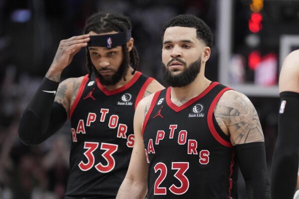 Toronto Raptors guard Fred VanVleet (23) and guard Gary Trent Jr. (33) walk off the court for a timeout during the second half of the team's NBA basketball play-in tournament game against the Chicago Bulls on Wednesday, April 12, 2023, in Toronto. (Frank Gunn/The Canadian Press via AP)