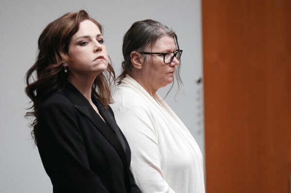 Attorney Shannon Smith, left, stands next to defendant Jennifer Crumbley during her trial, Monday, Feb. 5, 2024 in Pontiac, Mich. A Michigan jury on Tuesday, Feb. 6, 2024, has found Crumbley, a school shooter’s mother, guilty of involuntary manslaughter in a groundbreaking trial to determine whether she has any responsibility in the deaths of four students in 2021. (AP Photo/Carlos Osorio, Pool, File)