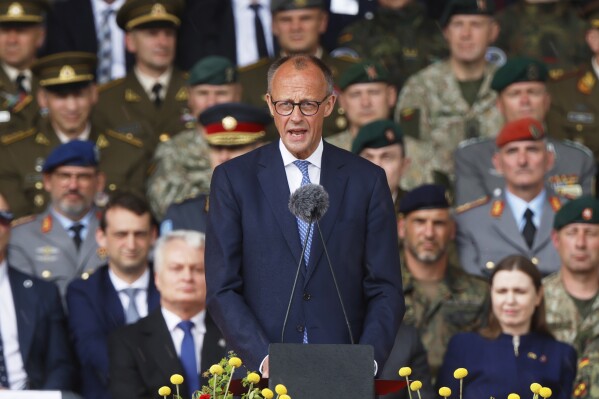German Chancellor Friedrich Merz holds a speech at a formal inauguration of a German brigade for NATO's eastern flank in Vilnius, Lithuania, Thursday, May 22, 2025. (AP Photo/Mindaugas Kulbis)