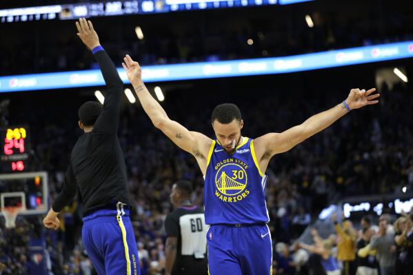 Davidson's Stephen Curry celebrates after a shot in the second