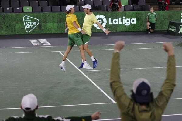 Australia's Matthew Ebden, right, and Max Purcell celebrate during the Davis Cup group C tennis match  against France's Nicolas Mahut and Arthur Rinderknech, in Hamburg, Germany Thursday, Sept. 15, 2022. (Frank Molter/dpa via AP)