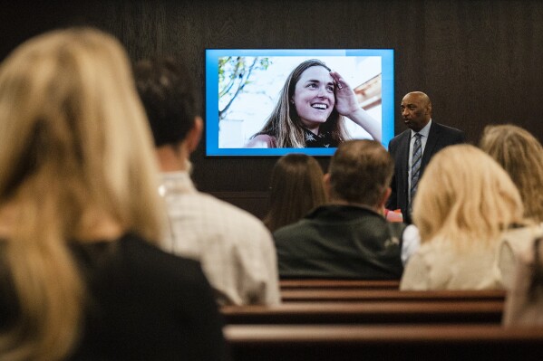 FILE - Anna Moriah Wilson's photo is displayed on the screen as state attorney Rickey Jones addresses the jury during the sentencing portion of Kaitlin Armstrong's murder trial, Nov. 17, 2023, at the Blackwell-Thurman Criminal Justice Center in Austin, Texas. Federal investigators say a local want ad for a yoga instructor in Costa Rica helped them capture Armstrong, the woman who killed rising pro cyclist Wilson in 2022. (Mikala Compton/Austin American-Statesman via AP, Pool, File)