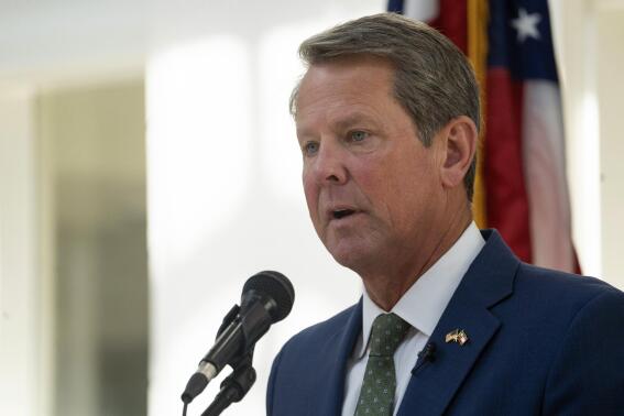 FILE - Georgia Gov. Brian Kemp speaks at Ola High School on July 29, 2022, in McDonough, Ga. On Friday, Sept. 23, 2022, the state Accounting Office reported that Georgia ran a surplus of more than $6 billion in the budget year that ended June 30, meaning the state's next governor and lawmakers could spend or give back billions. (AP Photo/Megan Varner, File)