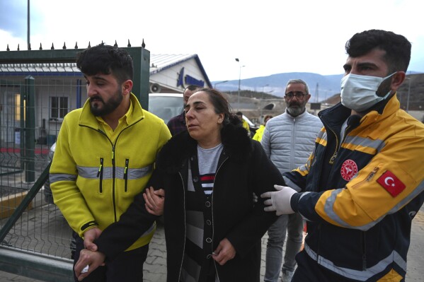 Relatives of missing miners leave the Copler gold mine near Ilic village, eastern Turkey, Wednesday, Feb. 14, 2024. Hundreds of rescuers on Wednesday pressed ahead with efforts to search for at least nine workers trapped at a gold mine in eastern Turkey that was engulfed by a massive landslide. (Mert Gokhan Koc/Dia images via AP)