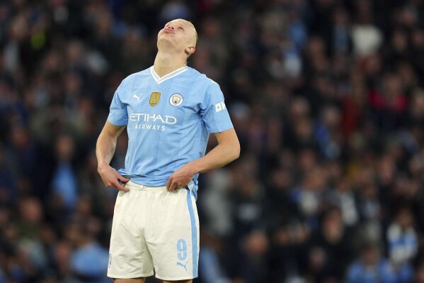 Manchester City's Erling Haaland reacts to a missed chance at goal, during the Champions League quarterfinal, second leg soccer match between Manchester City and Real Madrid, at the Etihad Stadium, in Manchester, England. Wednesday April 17, 2024. ( Mike Egerton/PA via AP)