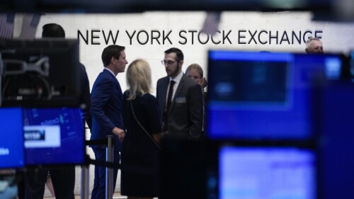 FILE - A sign is displayed on the floor of the New York Stock Exchange in New York, Wednesday, June 14, 2023. Halfway into 2023, and so little on Wall Street has gone according to plan. The S&P 500 has climbed roughly 14% as one of the most-predicted and longest awaited recessions in history has yet to appear. (AP Photo/Seth Wenig, File)