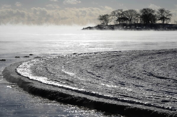 Steam rises off Lake Michigan alongside the shoreline in Evanston, Ill., Tuesday, Jan. 16, 2024. Hundreds and thousands of American citizens face below-zero temperatures as storms bring blast of Arctic air, snow and ice. (AP Describe/Nam Y. Huh)