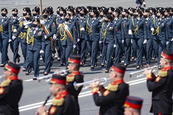 Troops march during a military parade held to celebrate Moldova's national day, three decades after the country declared independence from the Soviet Union, in Chisinau, Moldova, Friday, Aug. 27, 2021. The 30-year anniversary event was held in the capital's Grand National Assembly Square where President Maia Sandu was joined by Poland's President Andrzej Duda, Ukraine's President Volodymyr Zelenskyy and Romania's President Klaus Iohannis (AP Photo/Aurel Obreja)