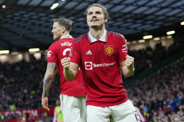 FILE - Manchester United's Marcel Sabitzer celebrates after scoring his side's second goal during the English FA Cup quarterfinal soccer match between Manchester United and Fulham at the Old Trafford stadium in Manchester, England, March 19, 2023. Borussia Dortmund signed Austria midfielder Marcel Sabitzer from league rival Bayern Munich on Monday July 24, 2023, boosting its options following Jude Bellingham’s departure for Real Madrid. (AP Photo/Jon Super, File)