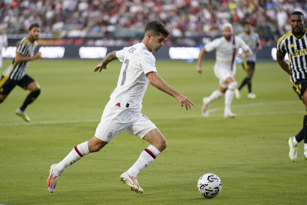 FILE - AC Milan forward Christian Pulisic (11) shoots during the first half of a Champions Tour soccer match against Juventus FC, Thursday, July 27, 2023, in Carson, Calif. (AP Photo/Ashley Landis, File)