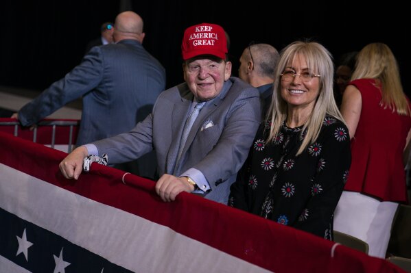 FILE - In this Feb. 21, 2020, file photo businessman and Republican donor Sheldon Adelson waits for the arrival of President Donald Trump to a campaign rally at the Las Vegas Convention Center in Las Vegas. Adelson and his wife have given $75 million to a new super PAC that is attacking Democratic nominee Joe Biden, an investment made amid GOP concern that President Donald Trump's campaign is flailing and might not be able to correct course. (AP Photo/Evan Vucci, File)