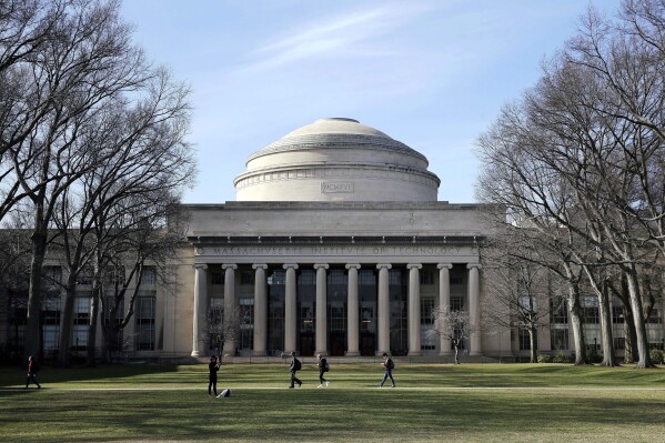 FILE - Students walk past the "Great Dome" atop Building 10 on the Massachusetts Institute of Technology campus in Cambridge, Mass, April 3, 2017. Two Jewish students on Thursday, March 7, 2024, filed a federal lawsuit against MIT accusing the university of allowing antisemitism on campus that has resulted in them being intimidated, harassed and assaulted. (AP Photo/Charles Krupa, File)