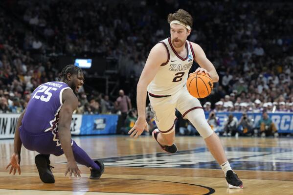 Gonzaga forward Drew Timme, right, drives the lane past TCU center Souleymane Doumbia in the second half of a second-round college basketball game in the men's NCAA Tournament Sunday, March 19, 2023, in Denver. (AP Photo/David Zalubowski)