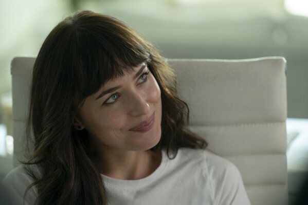This image released by Max shows Dakota Johnson in a scene from "Am I Ok?" (James Clark/Max via AP)