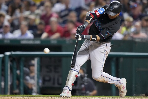 MIAMI, FL - MARCH 31: Miami Marlins third baseman Jean Segura (9) bats of  the Marlins during the game between the New York Mets and the Miami Marlins  on Friday, March 31