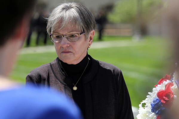 Kansas Gov. Laura Kelly participates in a ceremony honoring fallen law enforcement officers, Friday, May 3, 2024, outside the Statehouse in Topeka, Kan. The Democratic governor has vetoed the latest plan for cutting taxes from the Republican-controlled Kansas Legislature and plans to call lawmakers into a special legislative session to take up the issue again. (AP Photo/John Hanna)