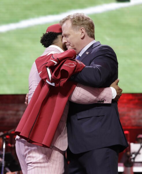 FILE - In this April 25, 2019, file photo, Oklahoma quarterback Kyler Murray embraces NFL Commissioner Roger Goodell after the Arizona Cardinals selected Murray in the first round at the NFL football draft in Nashville, Tenn. NFL vice president Troy Vincent has sent a letter to several prospects inviting them to participate “live” in the NFL draft in three weeks. In recent drafts, first-round selections were announced by Commissioner Goodell. Then followed hugs involving players and Goodell — some of them comical — and photo sessions with the players wearing team ball caps or even showing off team jerseys. This year, with all public events at the planned site of Las Vegas canceled and the draft set to proceed remotely, players will likely be at their homes when their names are called. (AP Photo/Mark Humphrey, File)