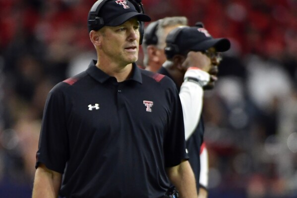 FILE - Texas Tech head coach Matt Wells watches from the sideline as his team plays Houston during the first half of an NCAA college football game Sept. 4, 2021, in Houston. Kansas State hired former Texas Tech coach Wells, Thursday, Jan. 4, 2024, to join offensive line coach Conor Riley as the Wildcats’ co-offensive coordinators. (AP Photo/Justin Rex, File)