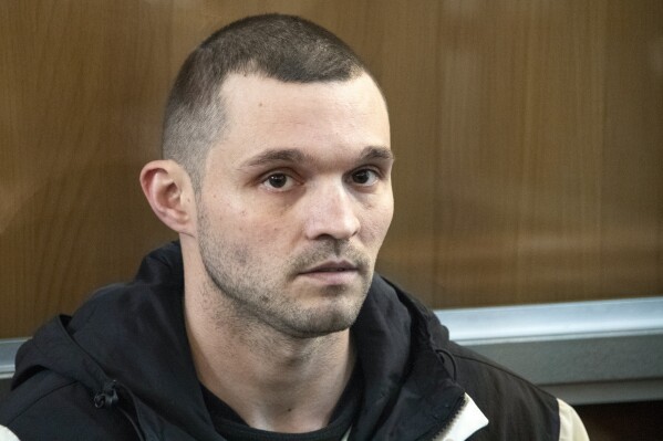 U.S. Army Staff Sgt. Gordon Black sits in a glass cage in courtroom in Vladivostok, Russia, Thursday, June 6, 2024. A court in Russia's far eastern city of Vladivostok on Thursday began the trial of an American soldier arrested in the city earlier this year on charges of stealing. He faces up to five years in prison if convicted. (AP Photo/)