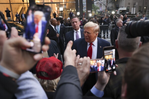 FILE - Former President Donald Trump speaks with construction workers at the construction site of the new JPMorgan Chase headquarters in midtown Manhattan, Thursday, April 25, 2024, in New York. (AP Photo/Yuki Iwamura, File)