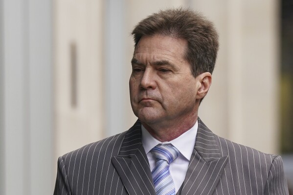 Dr Craig Wright arrives at the Rolls Building for a hearing over the identity of the creator of Bitcoin, in London, Monday, Feb. 5, 2024. An Australian computer scientist who says he's the mystery creator behind bitcoin has testified in a London court about the cryptocurrency's origins. Craig Wright says he used the pseudonym "Satoshi Nakamoto” to protect his privacy not to remain anonymous. (Lucy North/PA via AP)