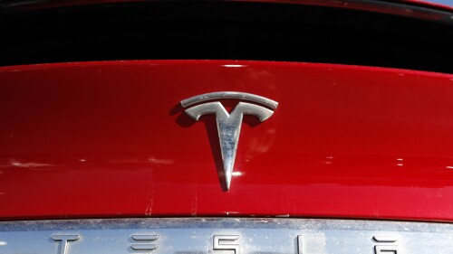 FILE - The Tesla company logo is shown at a Tesla dealership in Littleton, Colo., Feb. 2, 2020. A fatal July 2023 crash in California involving a Tesla has drawn the attention of federal investigators, who sent a team to the site of the site of what appears to have been a head-on crash. (AP Photo/David Zalubowski, File)