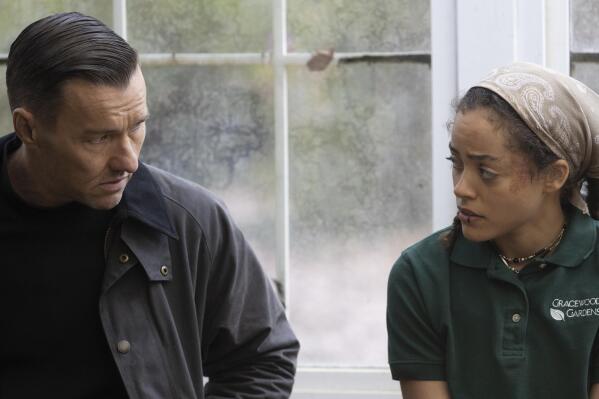 This image released by Magnolia Pictures shows Joel Edgerton, left, and Quintessa Swindell in a scene from "Master Gardener." (Magnolia Pictures via AP)