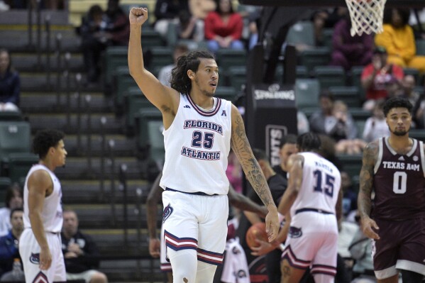 Florida Atlantic forward Tre Carroll (25) celebrates after a play during the second half of an NCAA college basketball game against Texas A&M, Friday, Nov. 24, 2023, in Kissimmee, Fla. (AP Photo/Phelan M. Ebenhack)