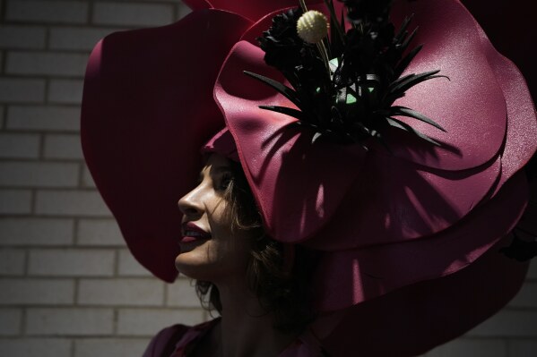 A race fan stands in a tunnel at Churchill Downs before the 151st running of the Kentucky Oaks horse race Friday, May 2, 2025, in Louisville, Ky. (AP Photo/Brynn Anderson)