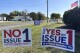 FILE - Signs for and against a proposed constitutional amendment to protect abortion rights in Ohio stand in front of the Greene County Board of Elections in Xenia, Ohio, Oct. 11, 2023. Abortion rights supporters have raised nearly twice as much money as anti-abortion groups in the fall campaign related to a constitutional amendment that would ensure abortion access in Ohio. Much of the money comes from national groups or wealthy donors outside the state. (AP Photo/Julie Carr Smyth)