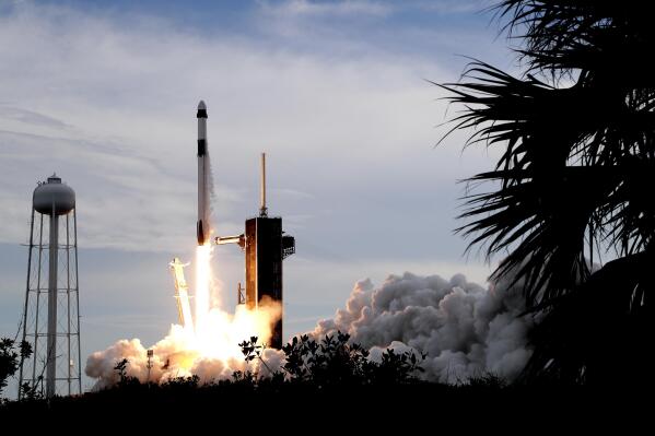 A SpaceX Falcon 9 rocket, with the Dragon capsule and a crew of four private astronauts, lifts off from Pad 39A at the Kennedy Space Center in Cape Canaveral, Fla., Sunday, May 21, 2023. (AP Photo/John Raoux)