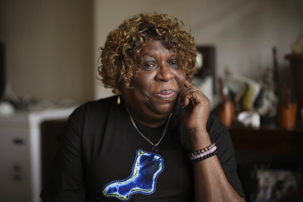 Chagossian Bernadette Dugasse pauses, during an interview with The Associated Press, at her home in London, Tuesday, March 25, 2025. (AP Photo/Kin Cheung)