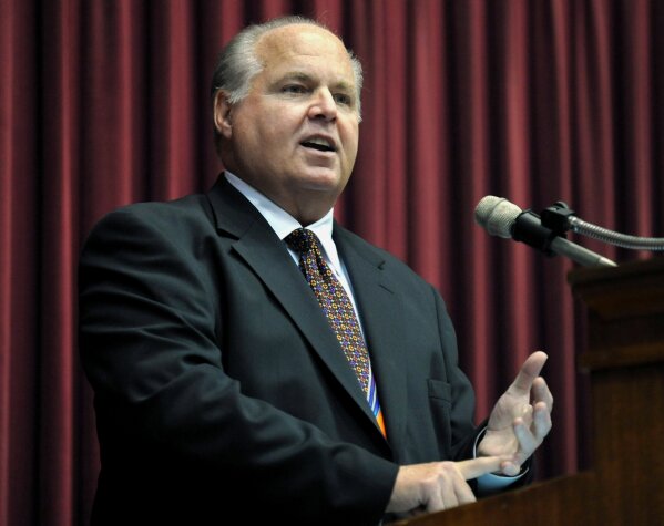 FILE - Rush Limbaugh speaks during a ceremony inducting him into the Hall of Famous Missourians on May 14, 2012, in the state Capitol in Jefferson City, Mo. Limbaugh died of lung cancer on Wednesday, Feb. 17, 2021. He was memorialized as the "greatest of all time" on Fox's website, but to critics who saw Limbaugh as a spreader of bigotry, it was good riddance. Limbaugh remained at the top of the heap among radio hosts even until his death. (AP Photo/Julie Smith, File)