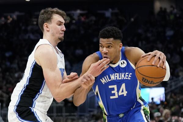 Milwaukee Bucks' Giannis Antetokounmpo (34) drives against Orlando Magic's Franz Wagner during the second half of an NBA basketball game Wednesday, March 1, 2023, in Milwaukee. (AP Photo/Aaron Gash)