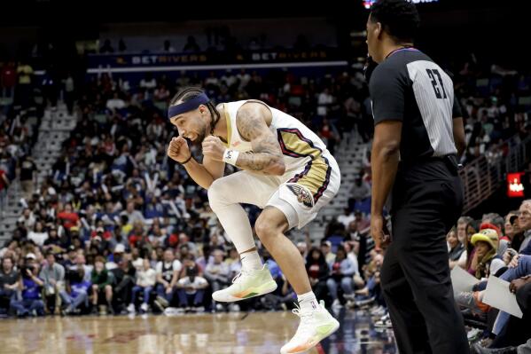 New Orleans Pelicans guard Jose Alvarado, left, reacts after missing a 3-point basket against the Orlando Magic in the first half of an NBA basketball game in New Orleans, Monday, Feb. 27, 2023. (AP Photo/Derick Hingle)