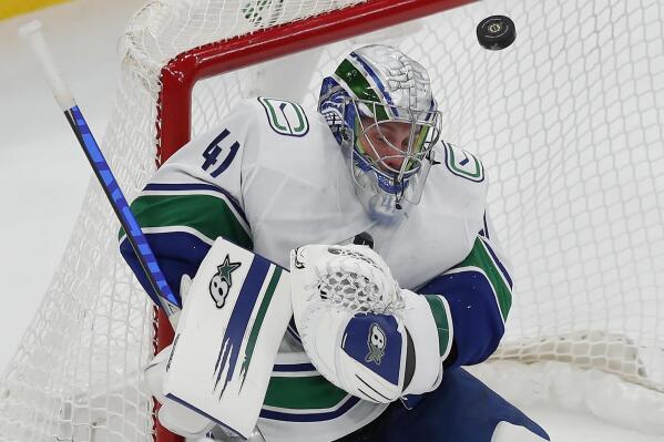 Vancouver Canucks' Jaroslav Halak blocks a shot during the second period of an NHL hockey game against the Boston Bruins, Sunday, Nov. 28, 2021, in Boston. (AP Photo/Michael Dwyer)